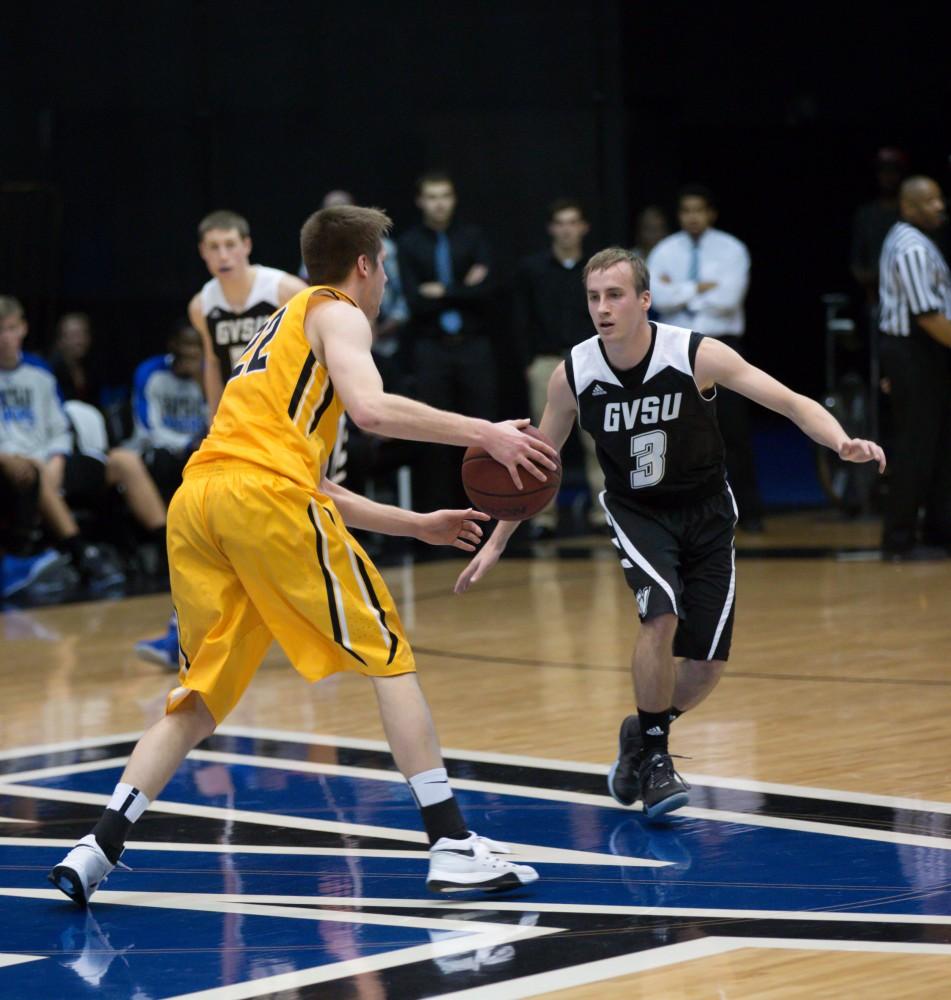 GVL / Kevin Sielaff - Darren Kapustka (3) defends the Huskies from mid court.  The Lakers defeat the Huskies of Michigan Tech with a final score of 64-53 Jan. 17, 2016 in Allendale.