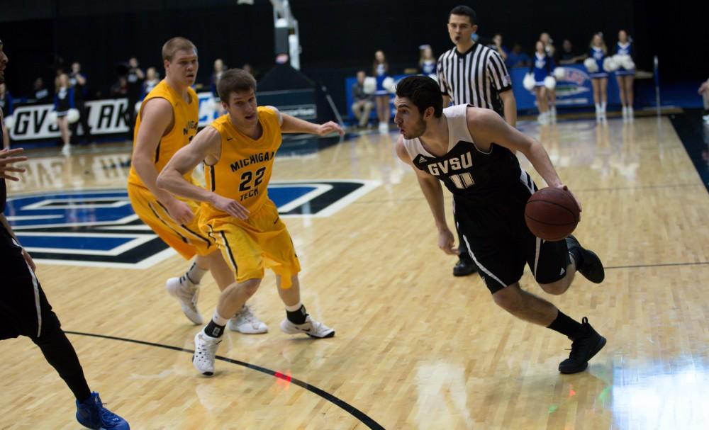 GVL / Kevin Sielaff - Zach West (11) drives hard on net and looks to pass.  The Lakers defeat the Huskies of Michigan Tech with a final score of 64-53 Jan. 17, 2016 in Allendale.