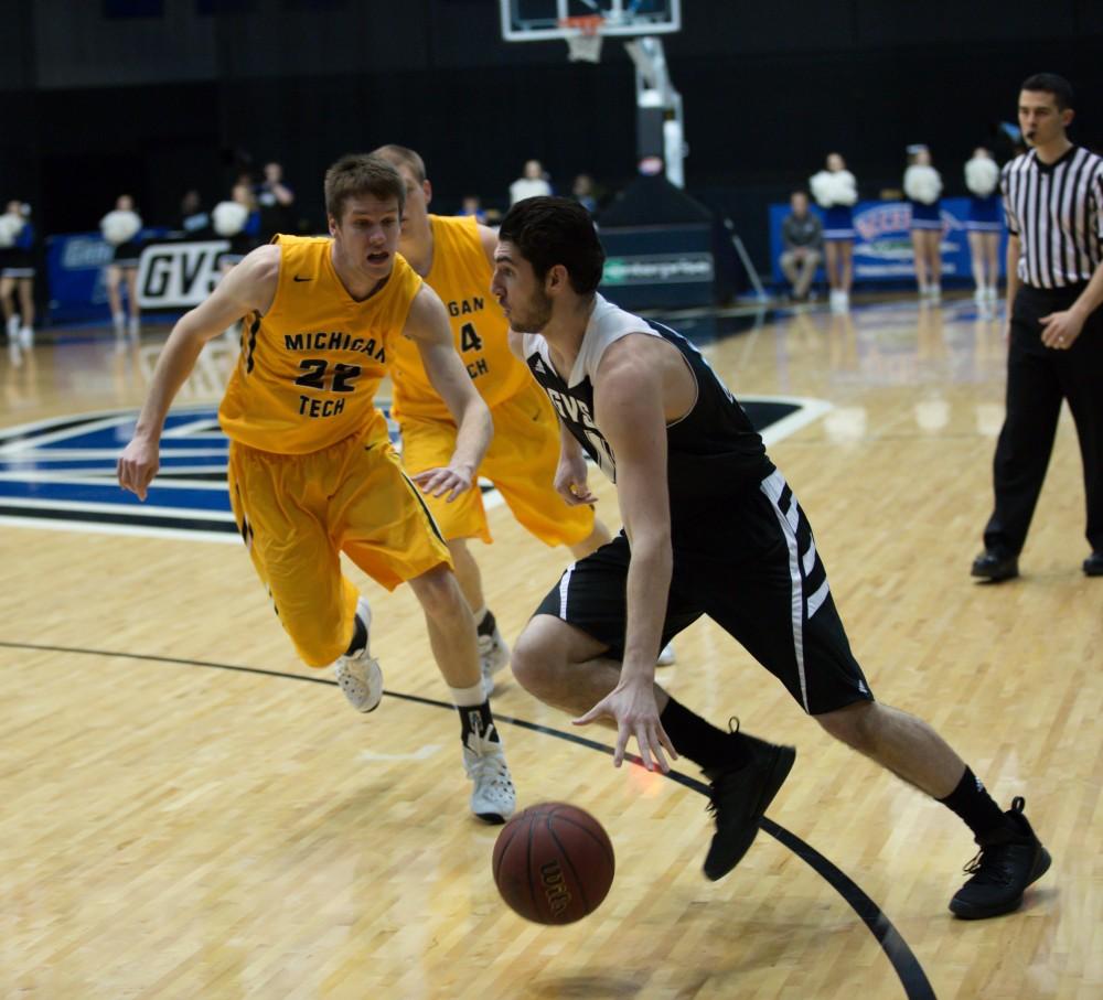 GVL / Kevin Sielaff - Zach West (11) drives hard on net and looks to pass.  The Lakers defeat the Huskies of Michigan Tech with a final score of 64-53 Jan. 17, 2016 in Allendale.