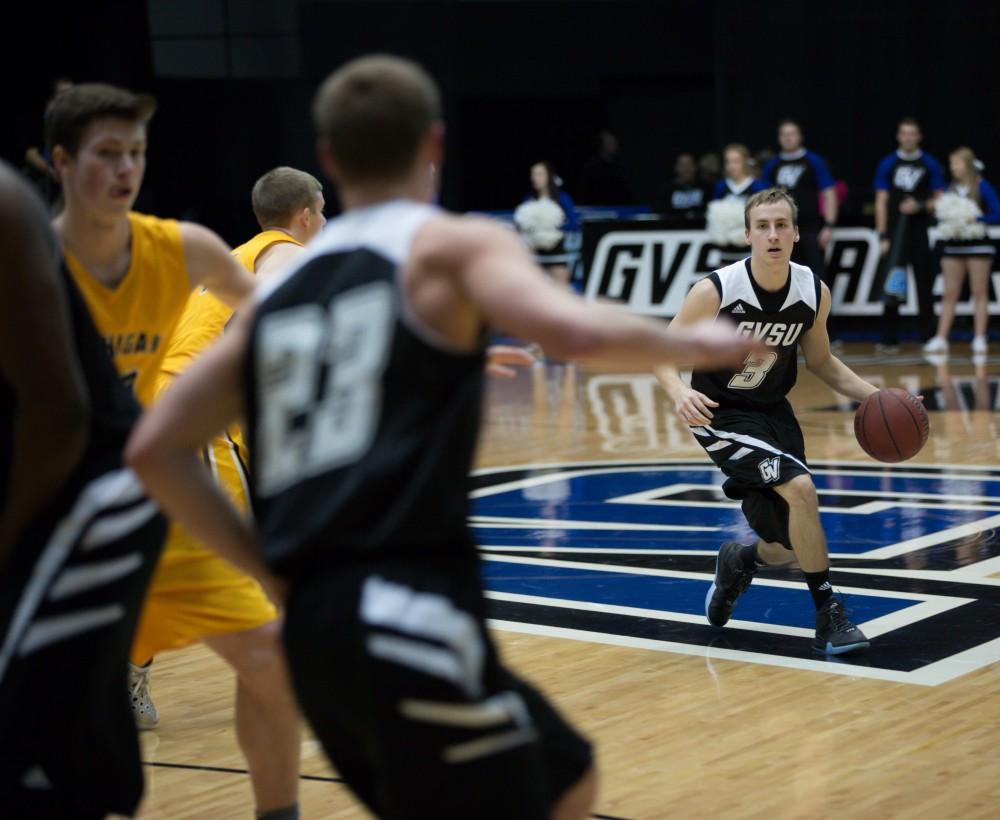 GVL / Kevin Sielaff - Darren Kapustka (3) looks to pass the ball to Luke Ryskamp (23).  The Lakers defeat the Huskies of Michigan Tech with a final score of 64-53 Jan. 17, 2016 in Allendale.