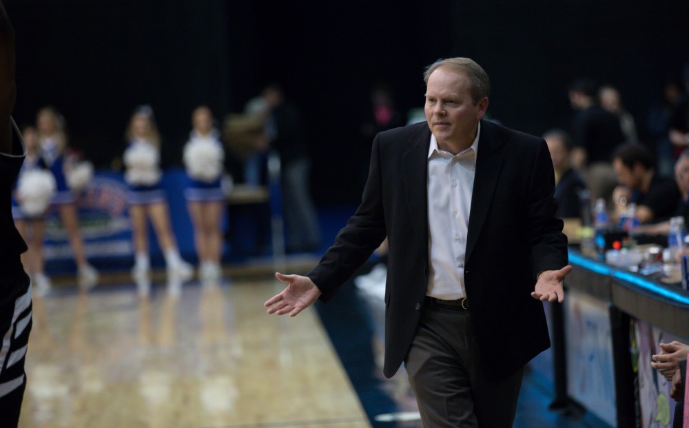 GVL / Kevin Sielaff - Head coach Ric Wesley chats with an official as he walks down the side of the court.  The Lakers defeat the Huskies of Michigan Tech with a final score of 64-53 Jan. 17, 2016 in Allendale.