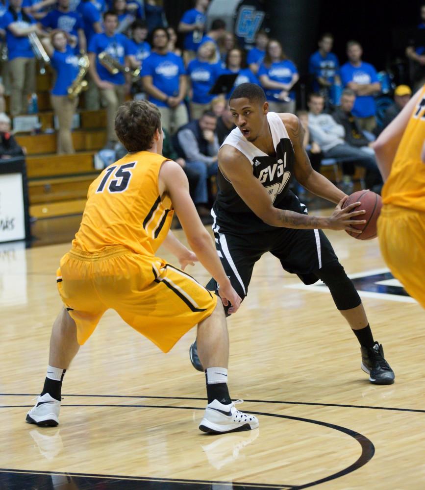 GVL / Kevin Sielaff - Deshawn Lewis (30) possesses the ball as he looks to pass.  The Lakers defeat the Huskies of Michigan Tech with a final score of 64-53 Jan. 17, 2016 in Allendale.