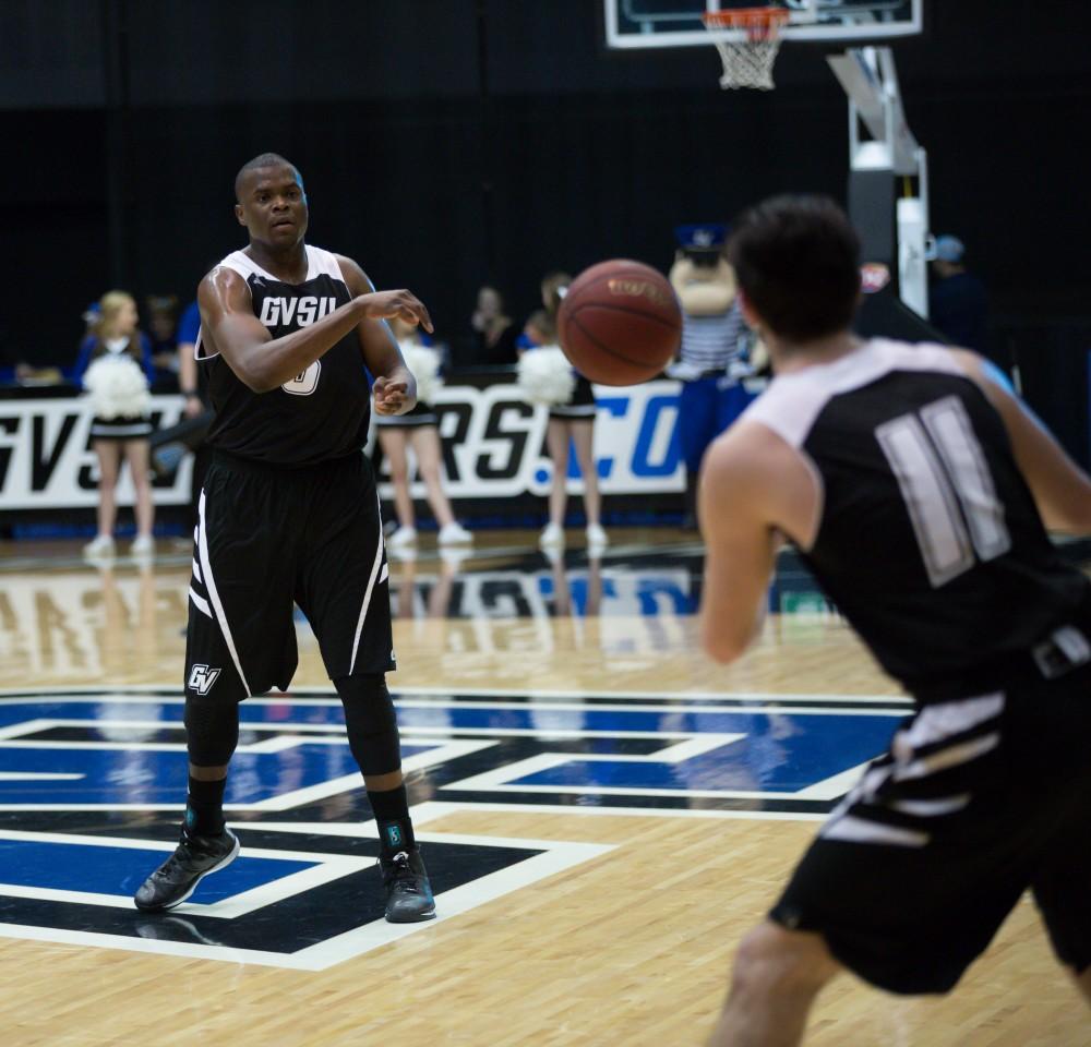 GVL / Kevin Sielaff - Trevin Alexander (5) shoots a pass off to Zach West (11).  The Lakers defeat the Huskies of Michigan Tech with a final score of 64-53 Jan. 17, 2016 in Allendale.