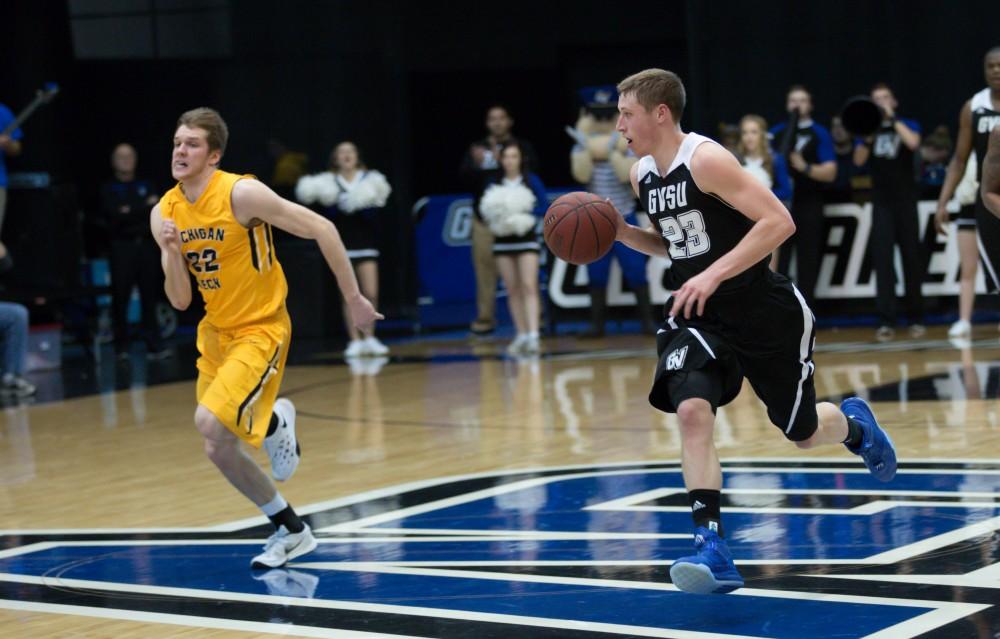 GVL / Kevin Sielaff - Luke Ryskamp (23), on a fast break, looks to his left to locate the Huskie defense.  The Lakers defeat the Huskies of Michigan Tech with a final score of 64-53 Jan. 17, 2016 in Allendale.