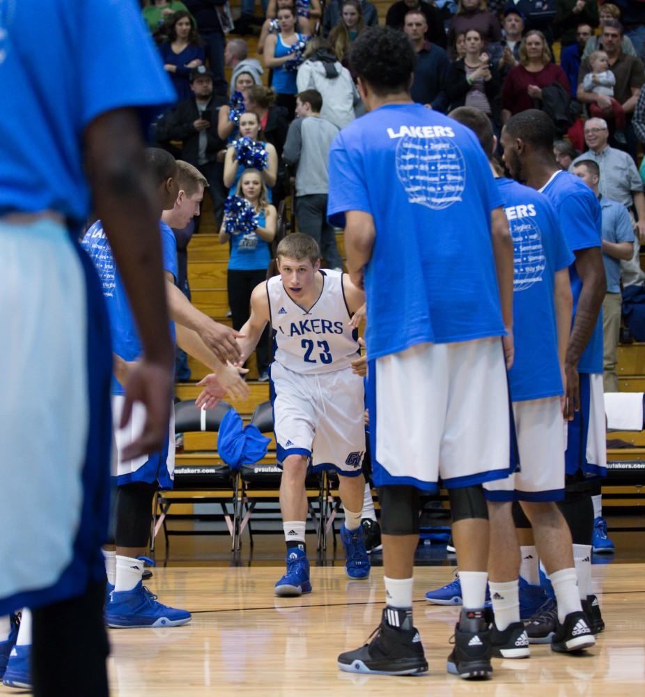 GVL / Kevin Sielaff - Luke Ryskamp (23) runs onto the court before the start of the match.  The Lakers defeat the Timberwolves of Northwood University with a final score of 66-53 Jan. 24, 2016 in Allendale.