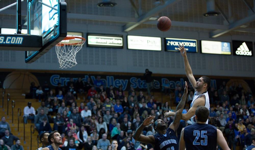 GVL / Kevin Sielaff - Ricardo Carbajal tries a long, one handed shot.  The Lakers defeat the Timberwolves of Northwood University with a final score of 66-53 Jan. 24, 2016 in Allendale.