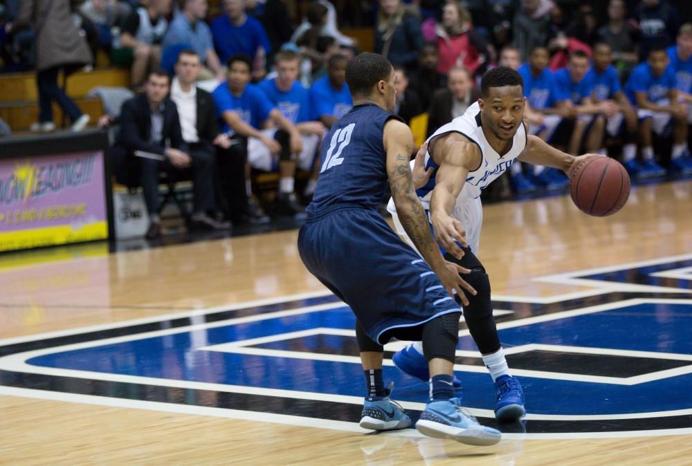 GVL / Kevin Sielaff - Aaron Hayes (1) jukes through Northwood's defense in the first quarter.  The Lakers defeat the Timberwolves of Northwood University with a final score of 66-53 Jan. 24, 2016 in Allendale.