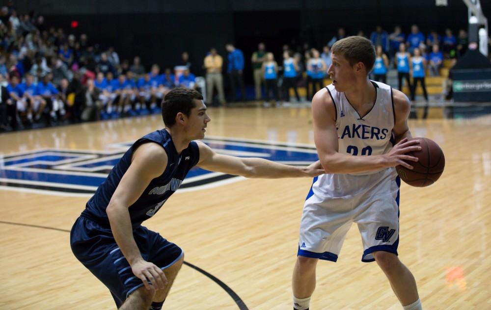 GVL / Kevin Sielaff - Luke Ryskamp (23) looks to pass the ball around the arch.  The Lakers defeat the Timberwolves of Northwood University with a final score of 66-53 Jan. 24, 2016 in Allendale.