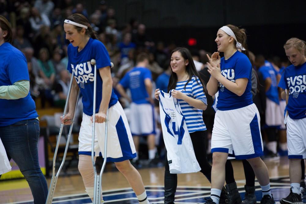 GVL / Kevin Sielaff - As part of international day, jerseys from the women's basketball game are handed out to exchange students. The Lakers defeat the Timberwolves of Northwood University with a final score of 66-53 Jan. 24, 2016 in Allendale.