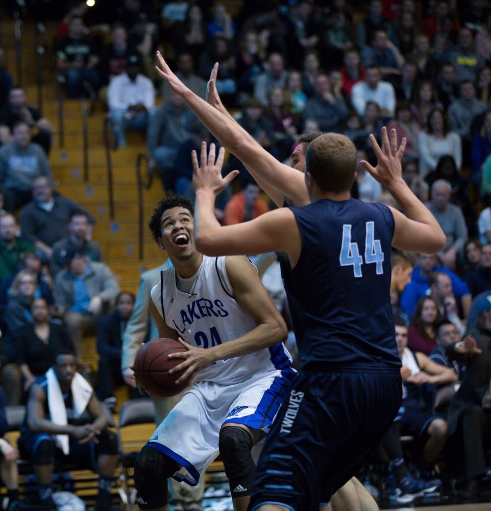 GVL / Kevin Sielaff - Justin Greason (24) looks to the basket through a crowd of Northwood hands.  The Lakers defeat the Timberwolves of Northwood University with a final score of 66-53 Jan. 24, 2016 in Allendale.