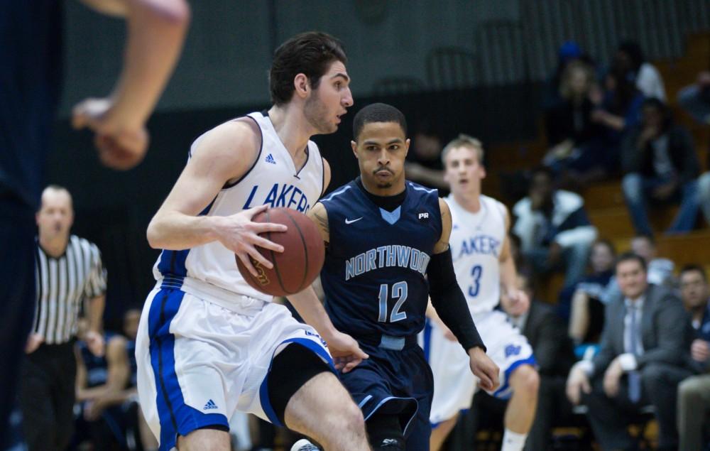 GVL / Kevin Sielaff - Zach West (11) picks up his dribble and looks to pass the ball.  The Lakers defeat the Timberwolves of Northwood University with a final score of 66-53 Jan. 24, 2016 in Allendale.