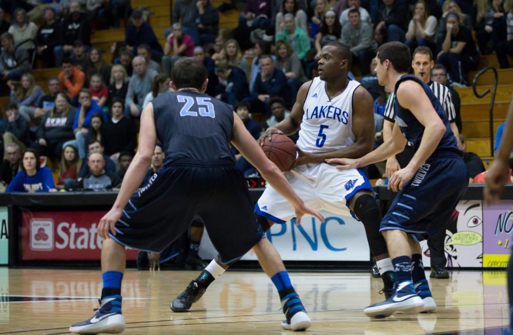 GVL / Kevin Sielaff - Trevin Alexander (5) looks to pass the ball.  The Lakers defeat the Timberwolves of Northwood University with a final score of 66-53 Jan. 24, 2016 in Allendale.