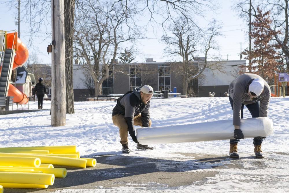 GVL / Sara CarteGrand Valley students help build Cherry Street Park’s new ice rink for the Martin Luther King community service projects on Jan. 23.
