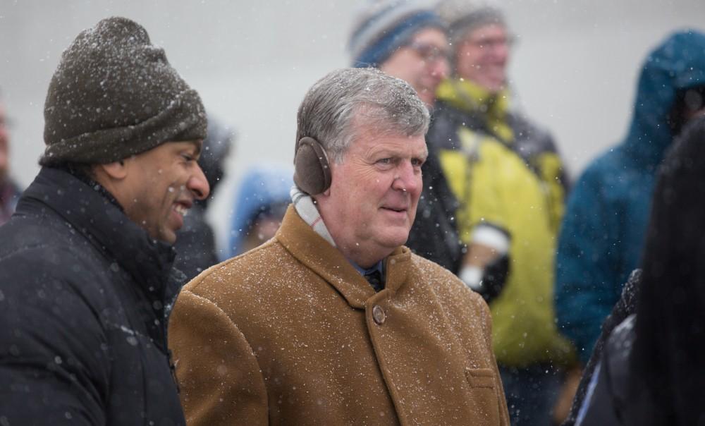 GVL / Kevin Sielaff - GVSU President Thomas Haas participates in a silent march before a presentation by Touré.  Touré, Vice columnist and well known author, visits Grand Valley's Allendale campus on a chilly Jan. 18, 2016. Hundreds of students gathered inside the Fieldhouse to listen to Touré's keynote speech; the students also participated in a silent march before the event.