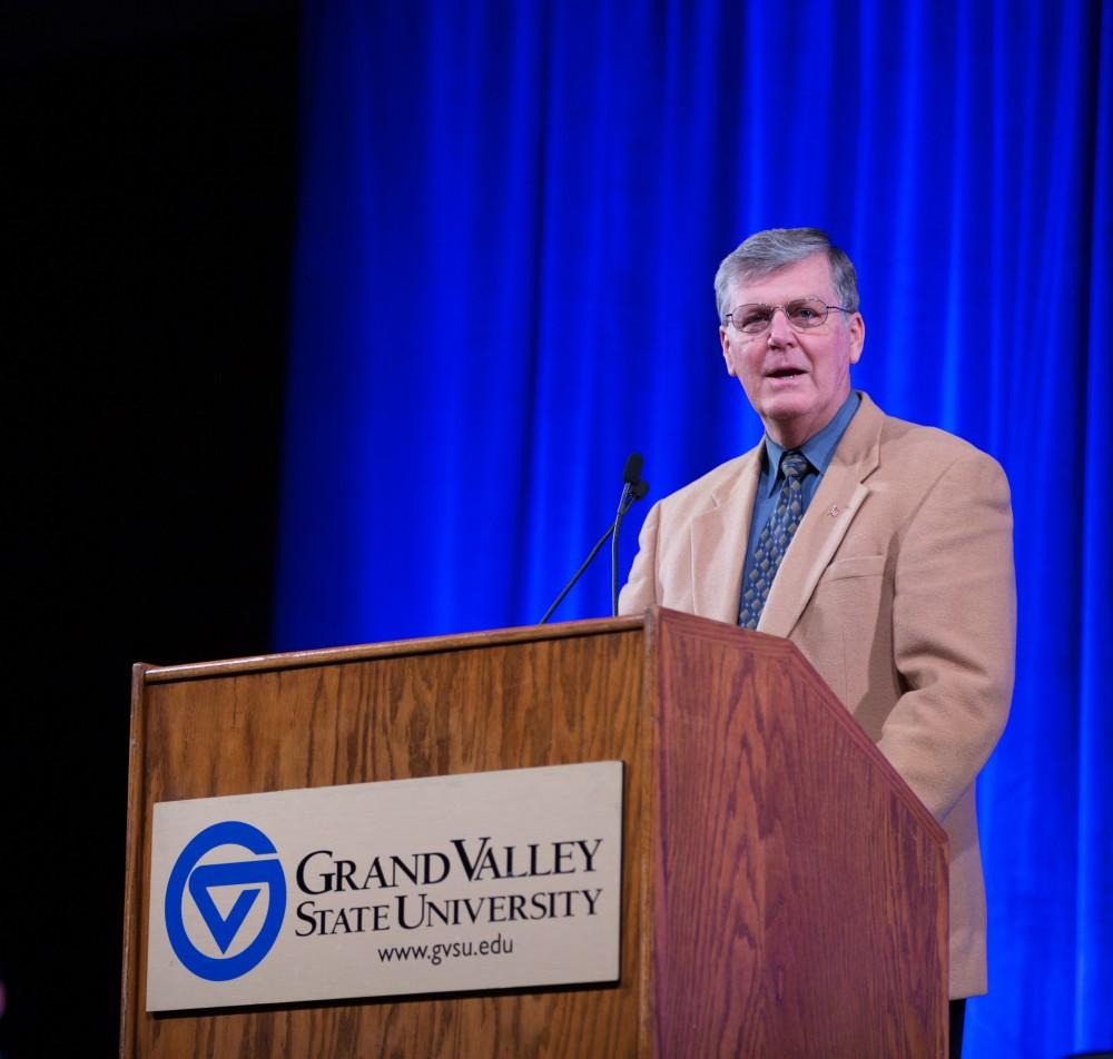 GVL / Kevin Sielaff - GVSU President Thomas Haas introduces the afternoon's keynote speaker Touré.  Touré, Vice columnist and well known author, visits Grand Valley's Allendale campus on a chilly Jan. 18, 2016. Hundreds of students gathered inside the Fieldhouse to listen to Touré's keynote speech; the students also participated in a silent march before the event.