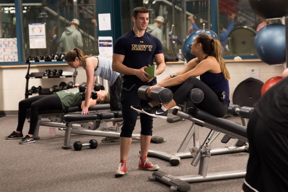 GVL/Luke HolmesStudents work out in the weight-lifting section of the rec center.