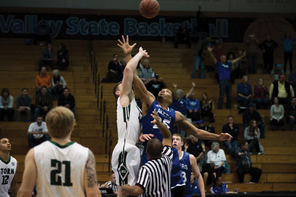 GVL/Luke Holmes
Chaz Rollins (no.25) reaches for the jump ball at the start of the game. The Lakers lost to Lake Erie College 78-84 on Dec. 5.