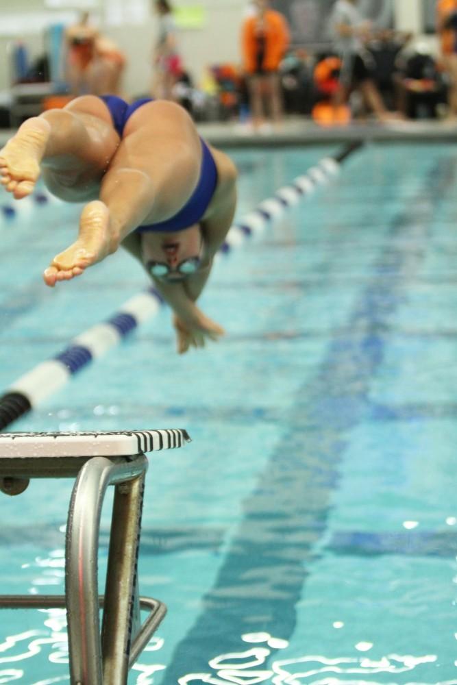 Grand Valley Swimmer dives into the water during a swimmeat against Findlay on Jan 23 in Allendale, MI. 