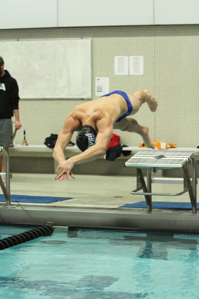 Grand Valley swimmer takes off to swim against Findlay on Jan 23 in Allendale, MI. 