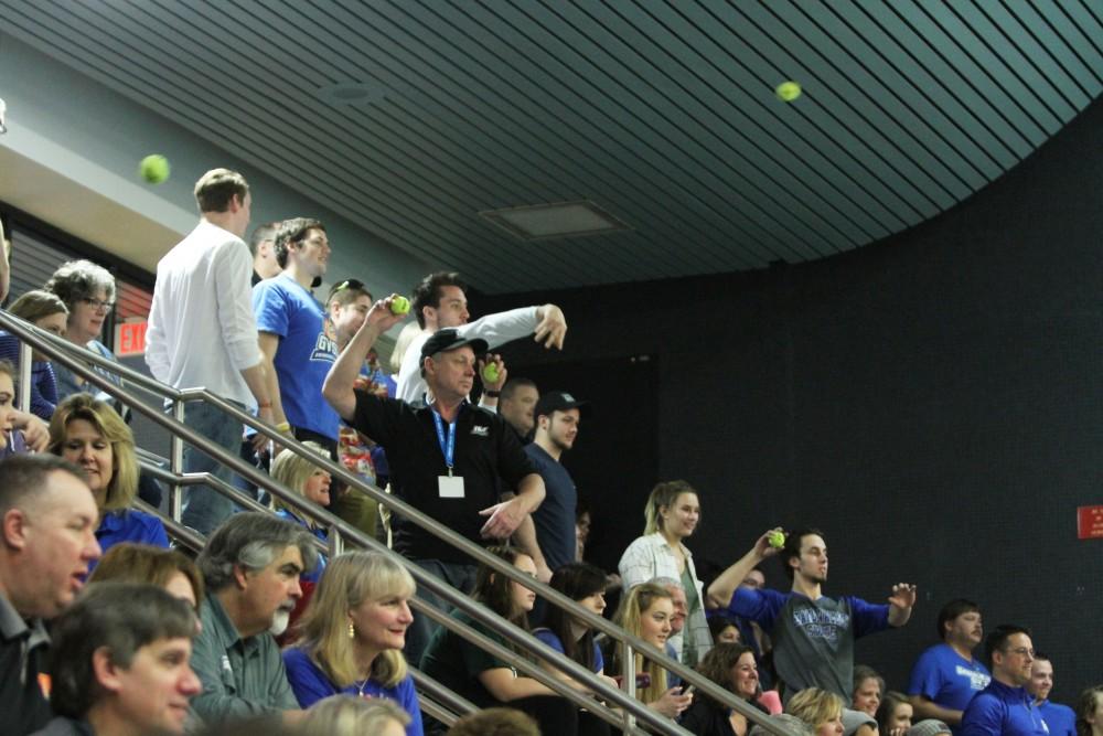 During the swimmeat against Findlay, people from the crowd threw in tennis balls during the break on Jan 23 in Allendale, MI. 