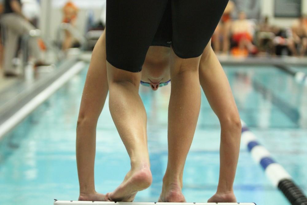 In position, Grand Valley Swimmer prepares to dive into the water while competing against Findlay on Jan 23 in Allendale, MI. 