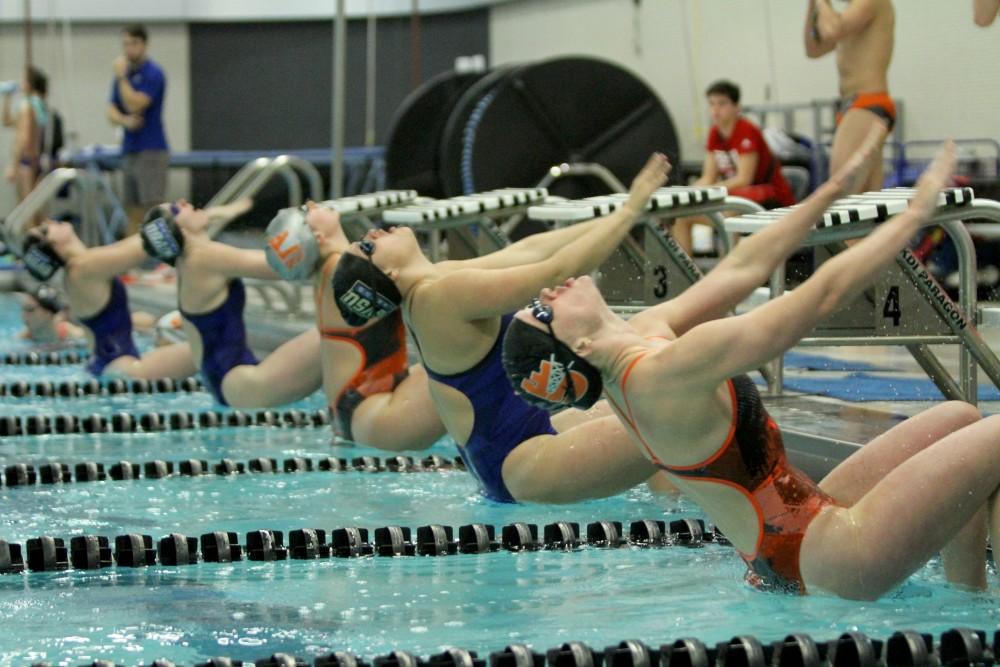 Beginning to take off, members of Grand Valley and Findlay Swim and Dive Team compete in backstroke on Jan 23 in Allendale, MI. 