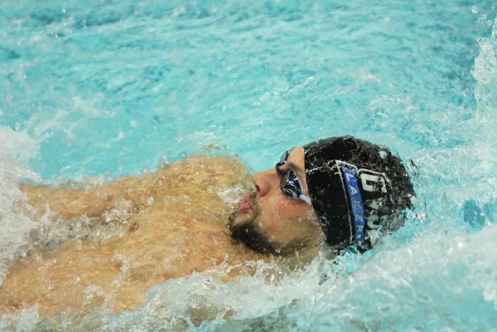 Jesus Morales swims backstroke against Findlay on Jan 23 in Allendale, MI. 