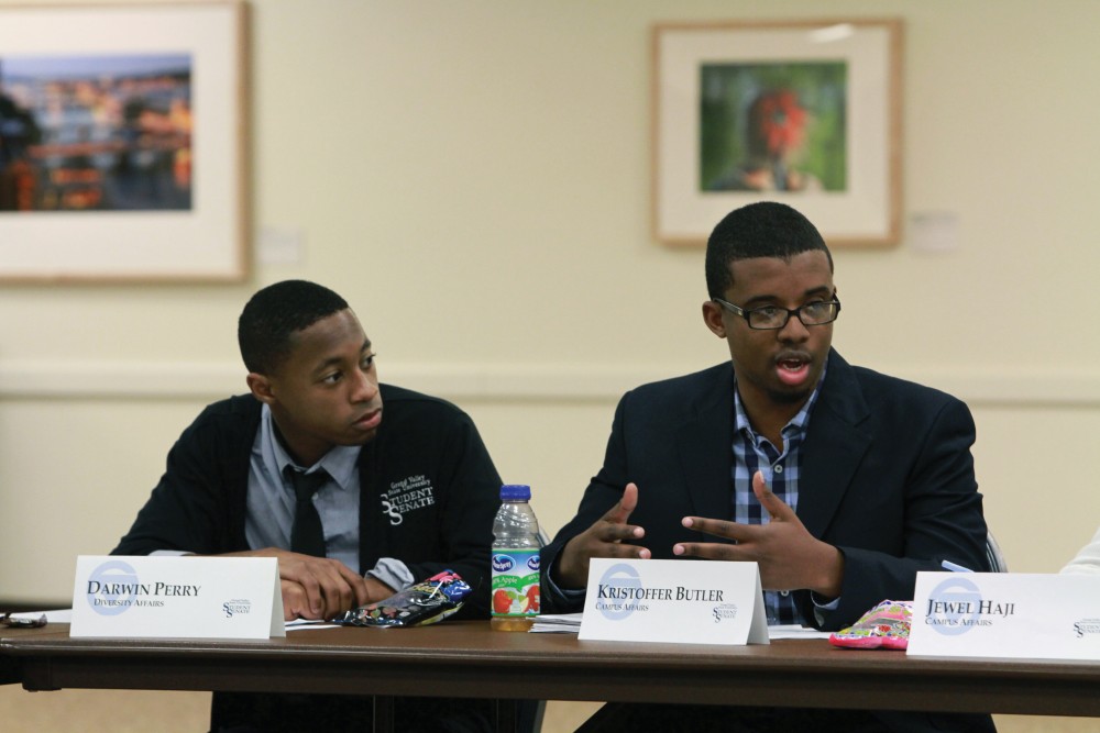 Darwin Perry and Kristoffer Butler listen and give their input during the student senate meeting on Nov. 6 in Allendale, MI. 