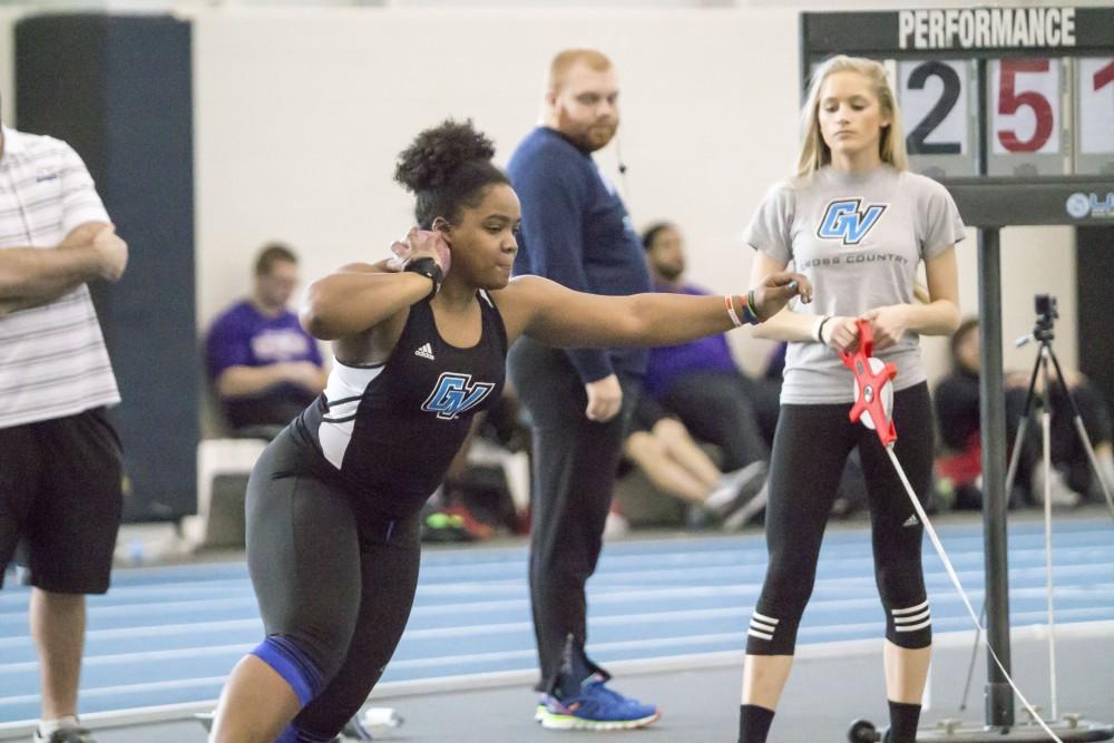 GVL / Sara Carte
Grand Valley Track and Field thrower, Mary Hecksel, throws shot put during the GVSU Mike Lints Alumni Open Meet in the Kelly Family Sports Center on Saturday, Jan. 30, 2016.