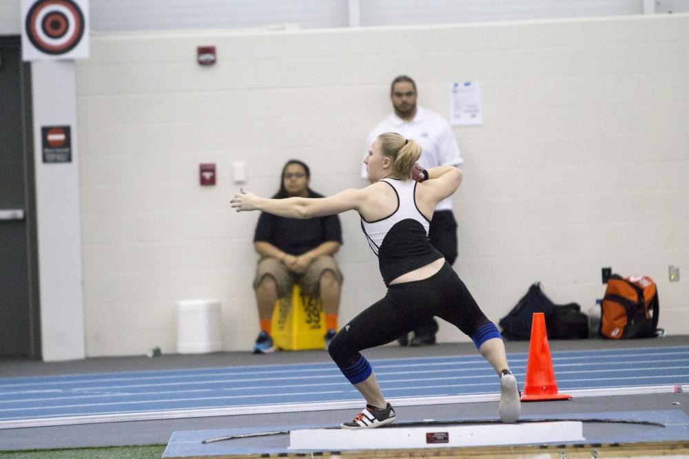 GVL / Sara Carte
Grand Valley Track and Field thrower, Jenae Linville, throws shot put during the GVSU Mike Lints Alumni Open Meet in the Kelly Family Sports Center on Saturday, Jan. 30, 2016.