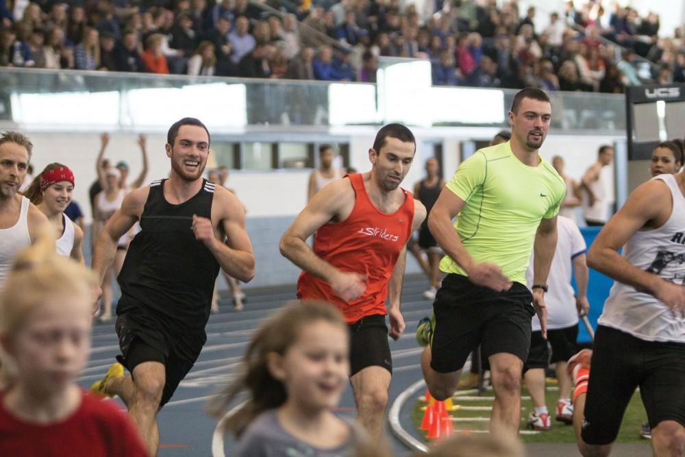 GVL / Sara Carte
Grand Valley Track and Field alumni and future Lakers race at the the GVSU Mike Lints Alumni Open Track and Field Meet in the Kelly Family Sports Center on Saturday, Jan. 30, 2016.