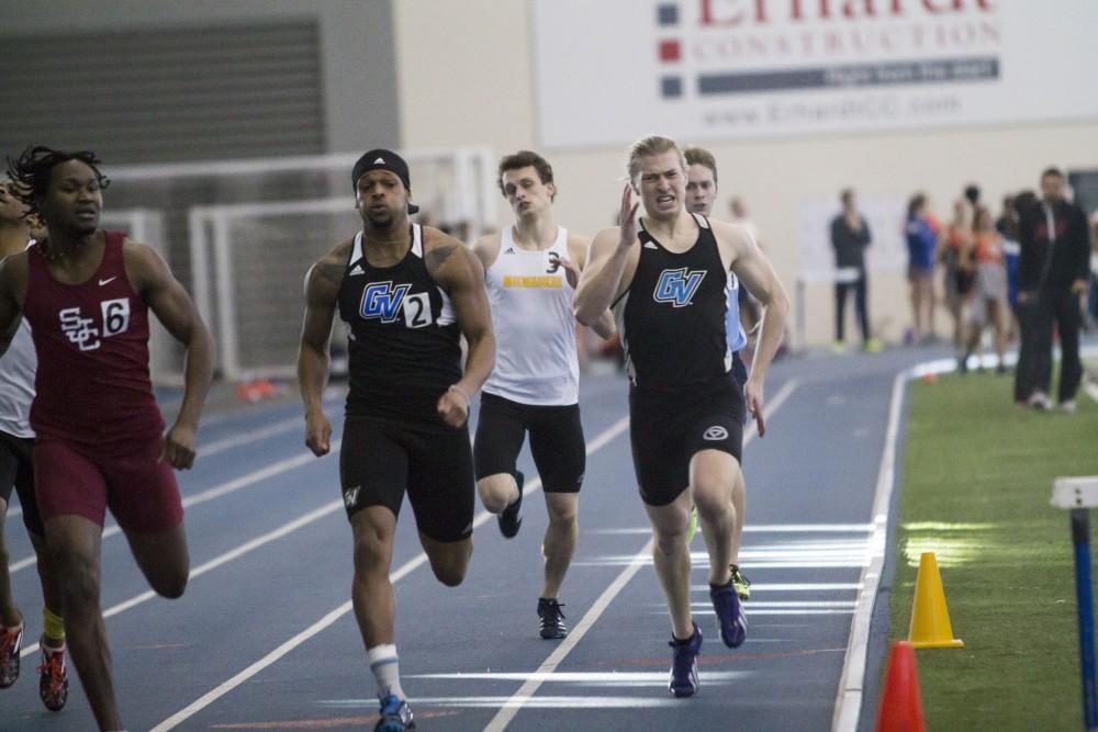 GVL / Sara Carte
Grand Valley Track and Field sprinters, Thomas Capers (left) and Zakry O’Brien (right), run the four hundred meter dash during the GVSU Mike Lints Alumni Open Meet in the Kelly Family Sports Center on Saturday, Jan. 30, 2016.