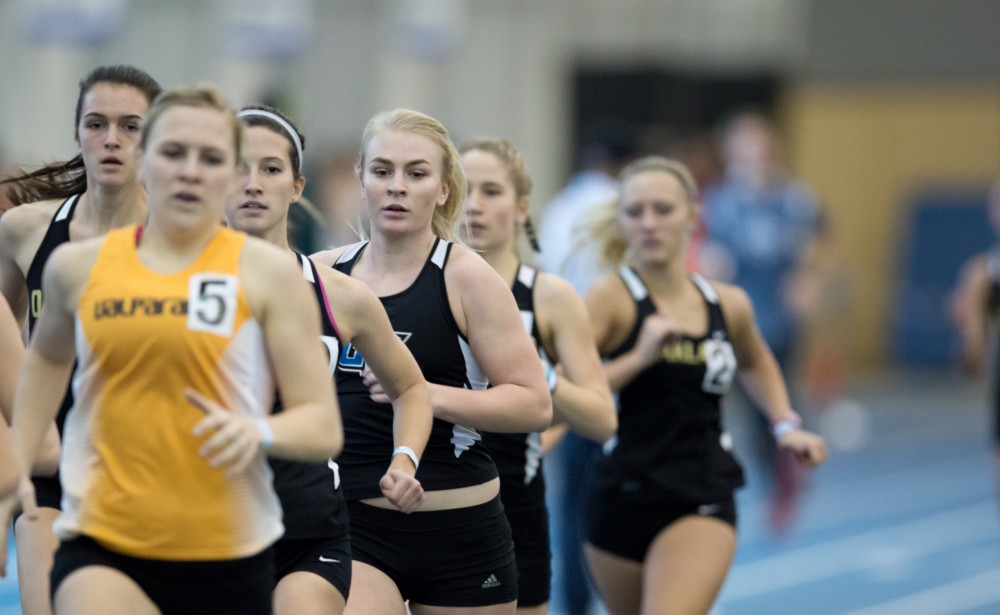 GVL / Kevin Sielaff - Marta McLaughlin participates in the women's mile run.  The Kelly Family Sports Center hosts the Bob Eubanks Open Jan. 15, 2016.