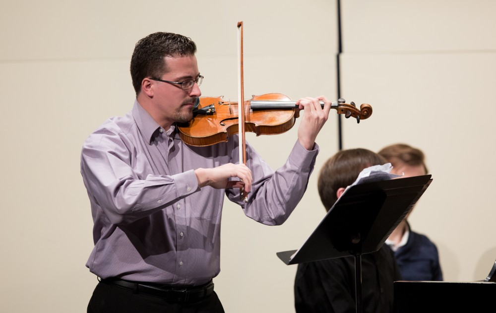 GVL / Kevin Sielaff - Andrew Uhe, former Grand Valley student, performs in the Louis Armstrong Theatre Jan. 14, 2016. Uhe, a native of West Michigan, currently lives in Texas where he performs with the symphony orchestras located in Victoria and Corpus Christi.