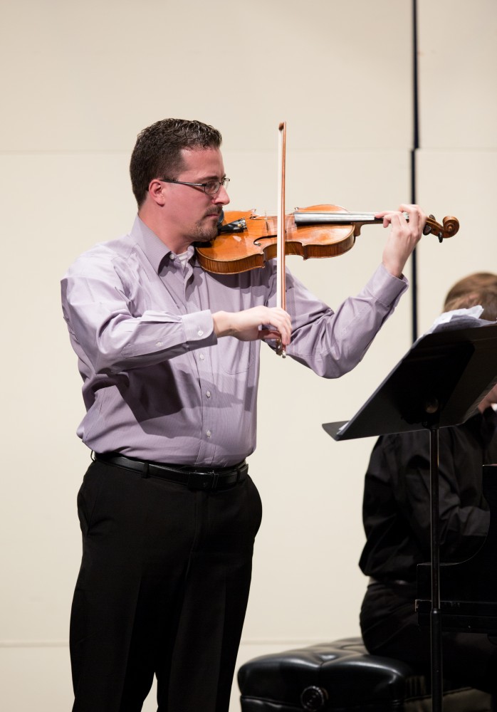 GVL / Kevin Sielaff - Andrew Uhe, former Grand Valley student, performs in the Louis Armstrong Theatre Jan. 14, 2016. Uhe, a native of West Michigan, currently lives in Texas where he performs with the symphony orchestras located in Victoria and Corpus Christi.