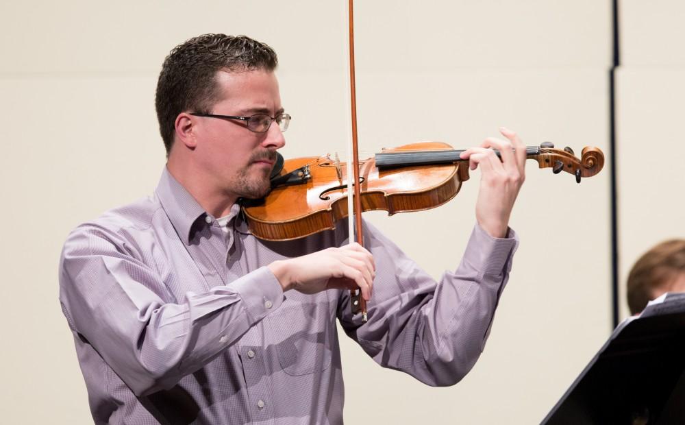 GVL / Kevin Sielaff - Andrew Uhe, former Grand Valley student, performs in the Louis Armstrong Theatre Jan. 14, 2016. Uhe, a native of West Michigan, currently lives in Texas where he performs with the symphony orchestras located in Victoria and Corpus Christi.