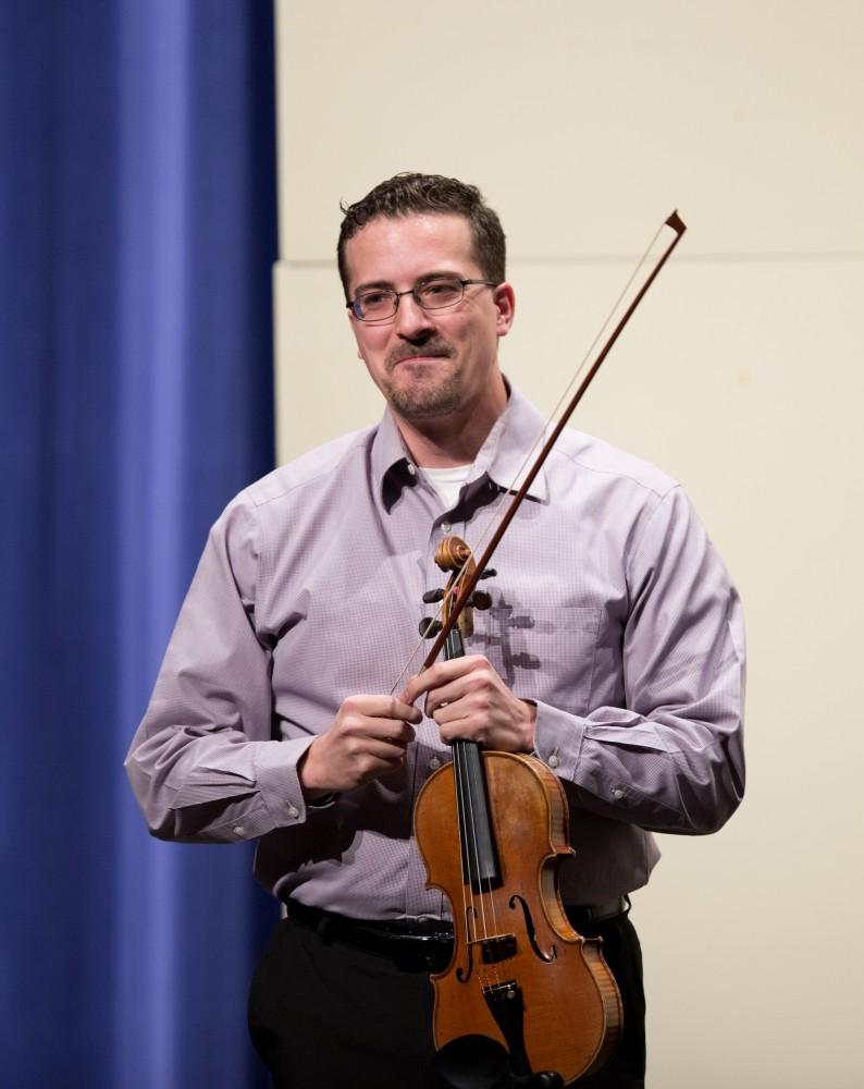 GVL / Kevin Sielaff - Andrew Uhe, former Grand Valley student, performs in the Louis Armstrong Theatre Jan. 14, 2016. Uhe, a native of West Michigan, currently lives in Texas where he performs with the symphony orchestras located in Victoria and Corpus Christi.