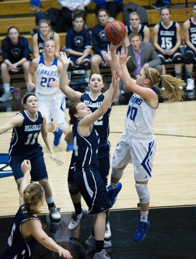 GVL / Kevin Sielaff - Taylor Lutz (10) tries a short range jumper in the paint.  The Lakers defeat the Chargers of Hillsdale College Saturday, Jan. 30, 2016 in Allendale.