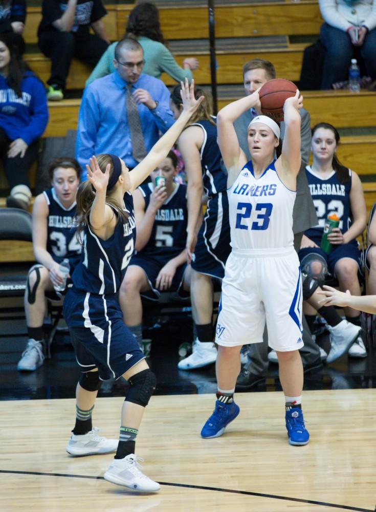 GVL / Kevin Sielaff - Kayla Dawson (23) looks to pass the ball.  The Lakers defeat the Chargers of Hillsdale College Saturday, Jan. 30, 2016 in Allendale.