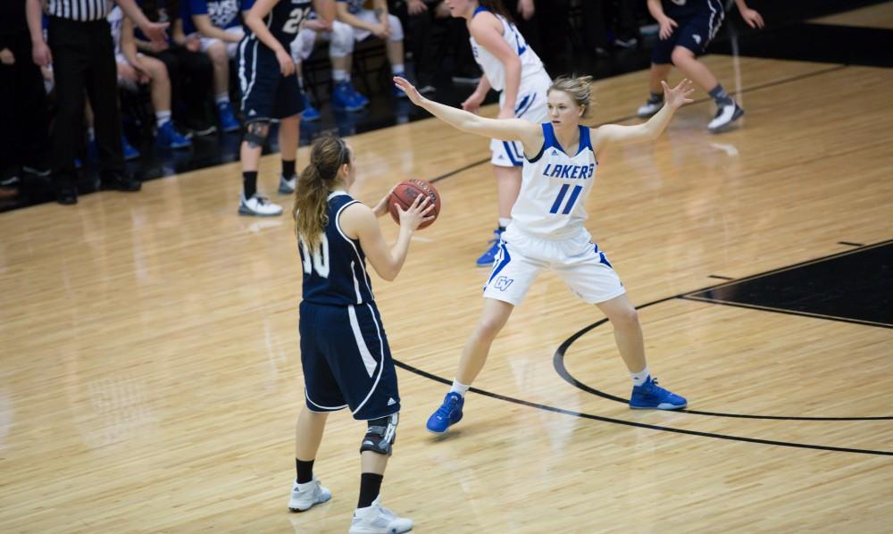 GVL / Kevin Sielaff - Piper Tucker (11) defends Brittany Gray (10) of Hillsdale.  The Lakers defeat the Chargers of Hillsdale College Saturday, Jan. 30, 2016 in Allendale.