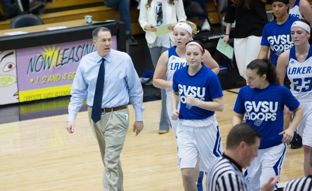 GVL / Kevin Sielaff - Head coach Mike Williams exits the the court with his team.  The Lakers defeat the Chargers of Hillsdale College Saturday, Jan. 30, 2016 in Allendale.