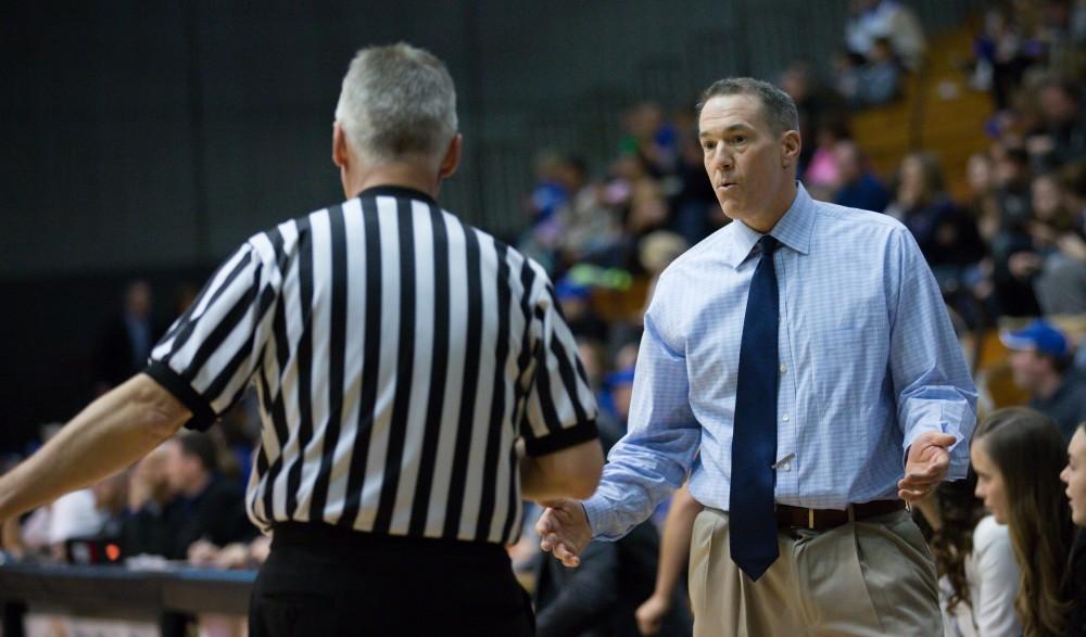 GVL / Kevin Sielaff - Head coach Mike Williams disputes a call with the referee.  The Lakers defeat the Chargers of Hillsdale College Saturday, Jan. 30, 2016 in Allendale.