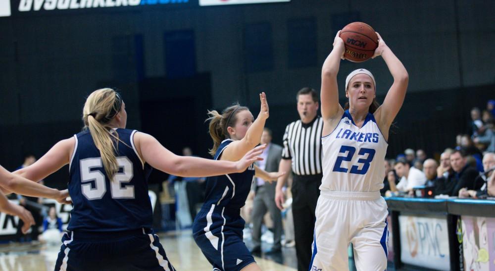 GVL / Kevin Sielaff - Kayla Dawson (23) looks to pass the ball around the arch.  The Lakers defeat the Chargers of Hillsdale College Saturday, Jan. 30, 2016 in Allendale.