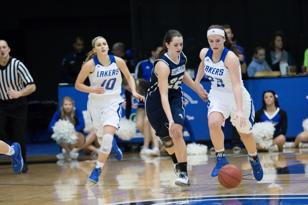 GVL / Kevin Sielaff - Kayla Dawson (23) drives down the court on a fast break.  The Lakers defeat the Chargers of Hillsdale College Saturday, Jan. 30, 2016 in Allendale.