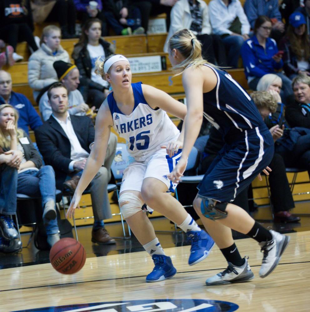 GVL / Kevin Sielaff - Lindsay Baker (15) dribbles around the a Hillsdale defender.  The Lakers defeat the Chargers of Hillsdale College Saturday, Jan. 30, 2016 in Allendale.