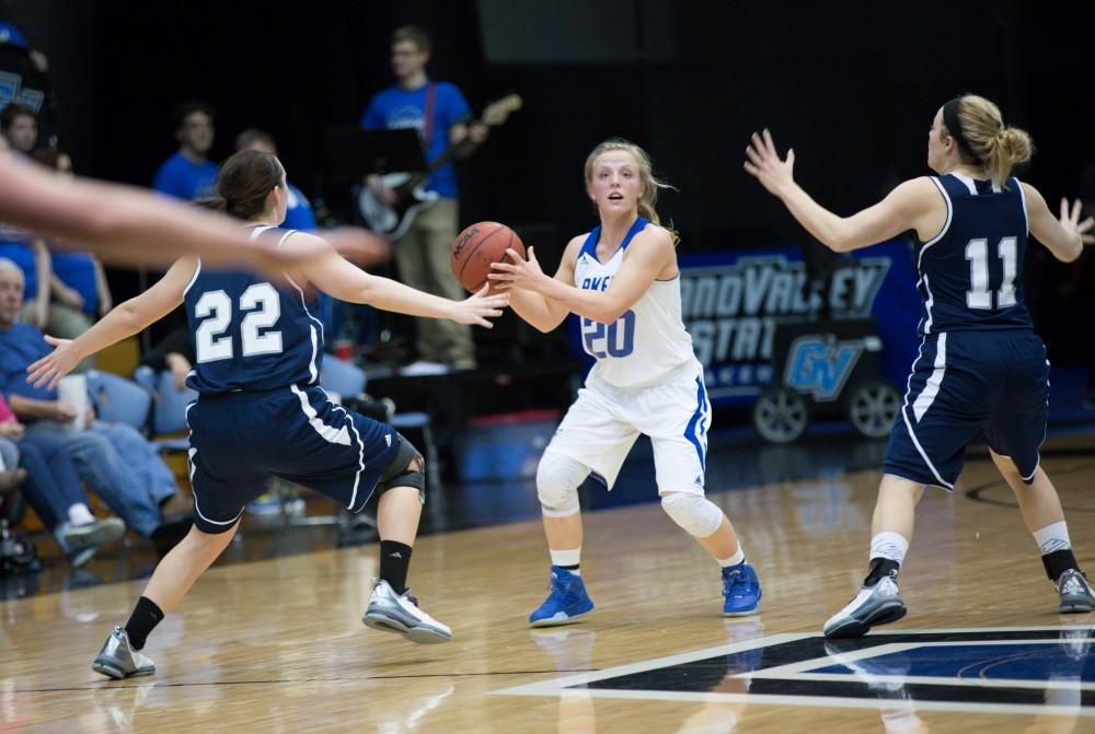 GVL / Kevin Sielaff - Janae Langs (20) looks to pass the ball off from mid court.  The Lakers defeat the Chargers of Hillsdale College Saturday, Jan. 30, 2016 in Allendale.