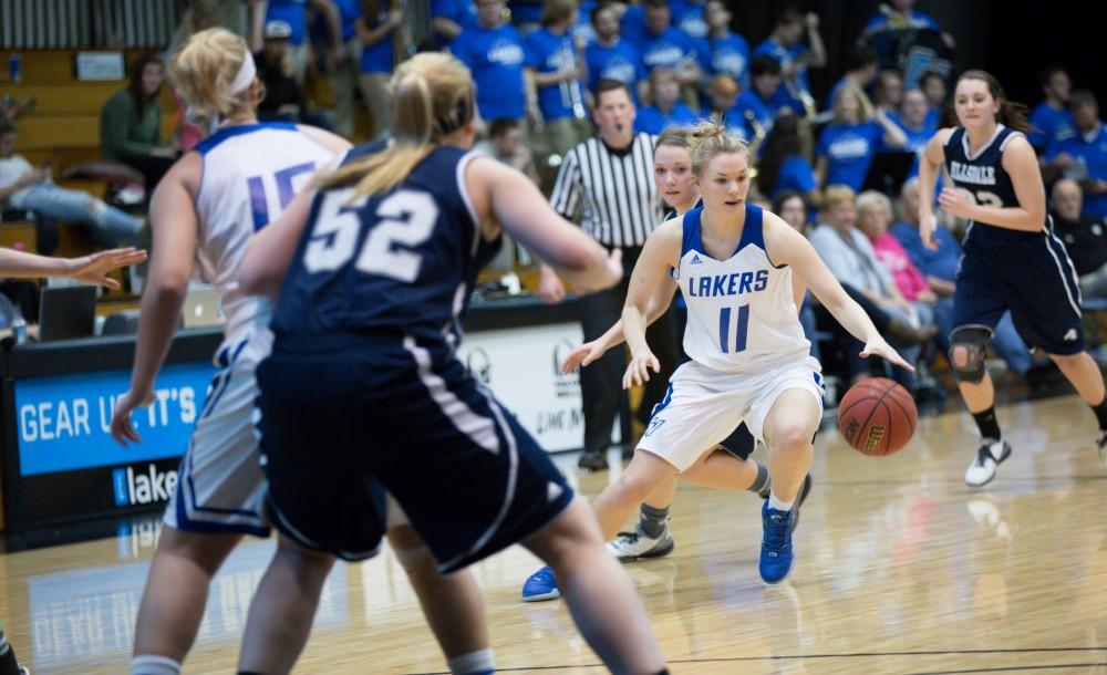 GVL / Kevin Sielaff - Piper Tucker (11) dribbles the ball up court.  The Lakers defeat the Chargers of Hillsdale College Saturday, Jan. 30, 2016 in Allendale.