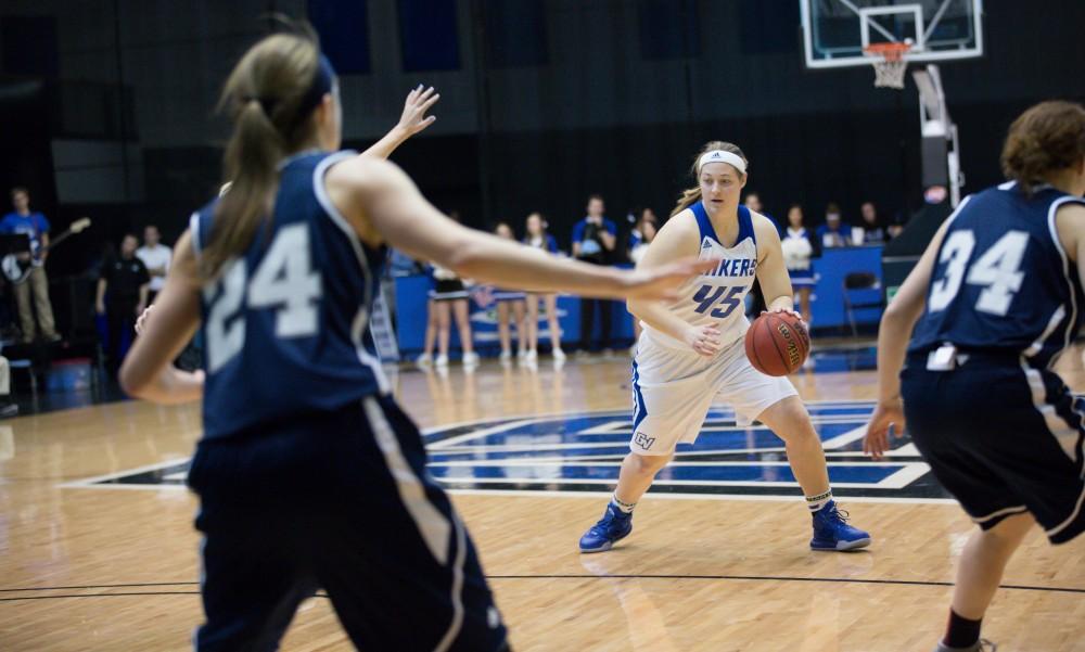 GVL / Kevin Sielaff - Lindsay Kusbel (45) receives a pass and drives the ball on net.  The Lakers defeat the Chargers of Hillsdale College Saturday, Jan. 30, 2016 in Allendale.