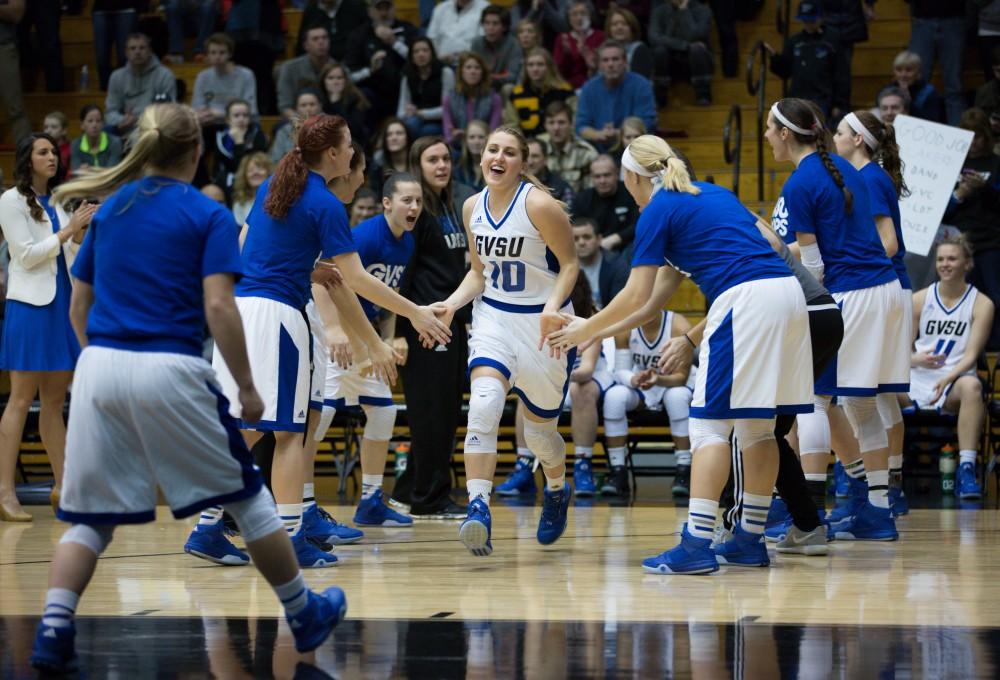 GVL / Kevin Sielaff - Taylor Lutz (10) runs onto the court at the start of the match.  The Lakers down the Timberwolves of Northwood University in Allendale with a final score of 71-47 Jan. 24, 2016.