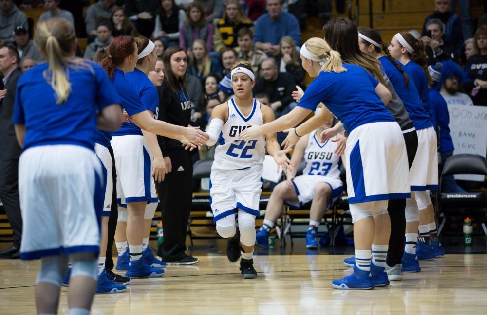 GVL / Kevin Sielaff - Brionna Barnett (22) runs onto the court at the start of the match.  The Lakers down the Timberwolves of Northwood University in Allendale with a final score of 71-47 Jan. 24, 2016.